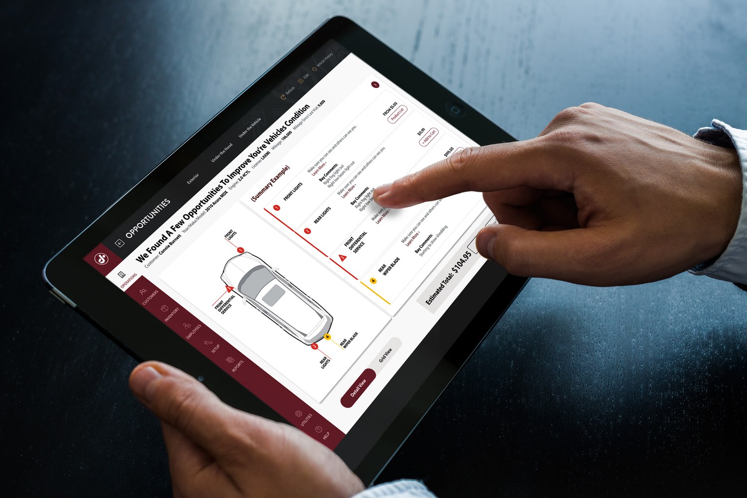 Jiffy Lube point-of-sale service review on a tablet in hand